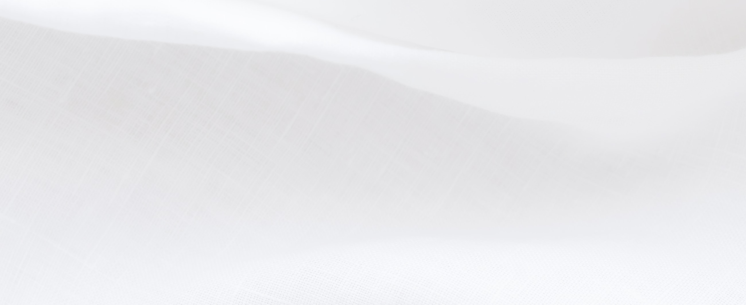 Woman applying skincare product to her face.